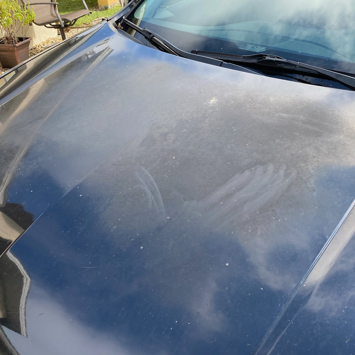 Oxidised and water spotted black paint on an Acura TLX bonnet before paint correction