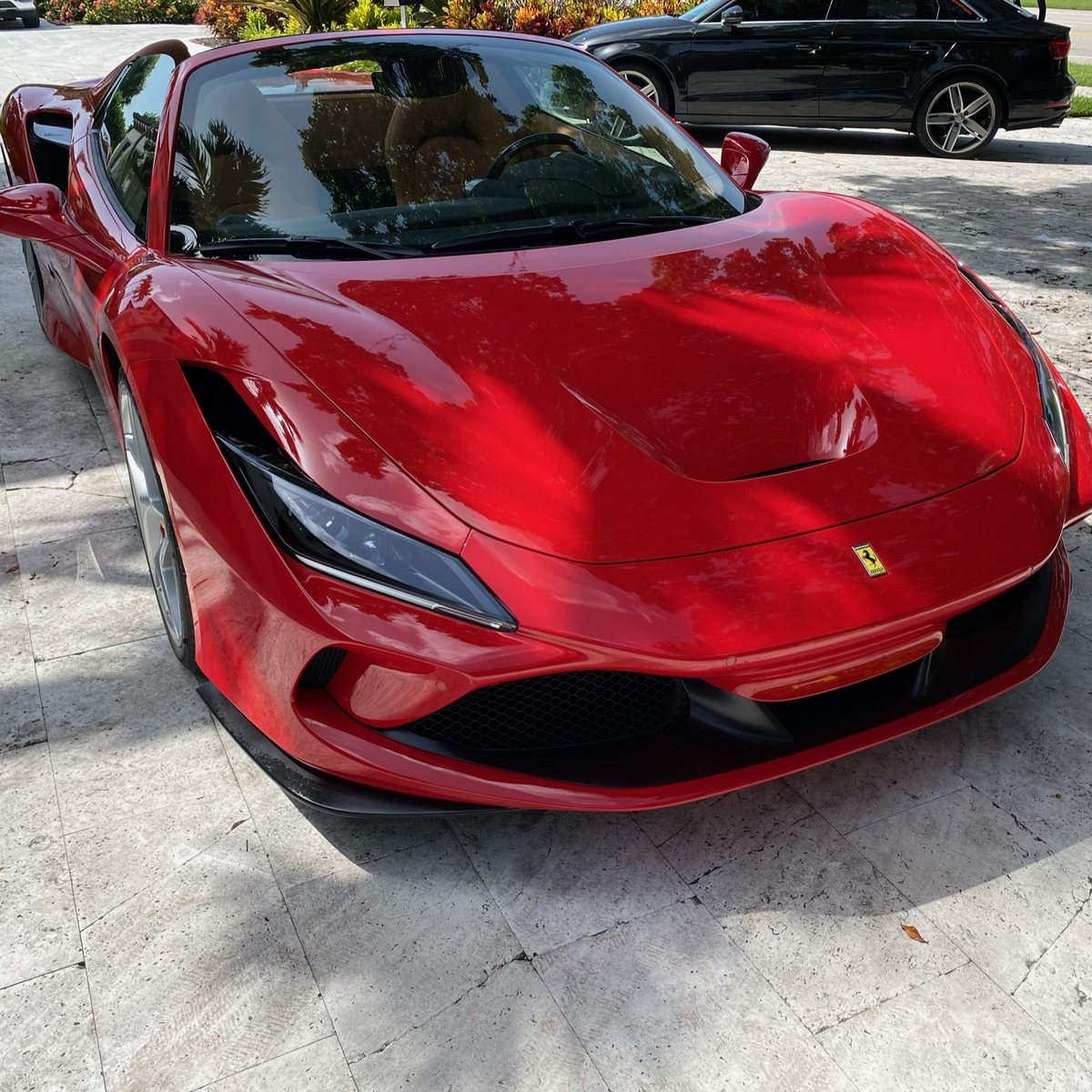 The same Ferrari F8 Spider rinsed, dried and finished in the driveway