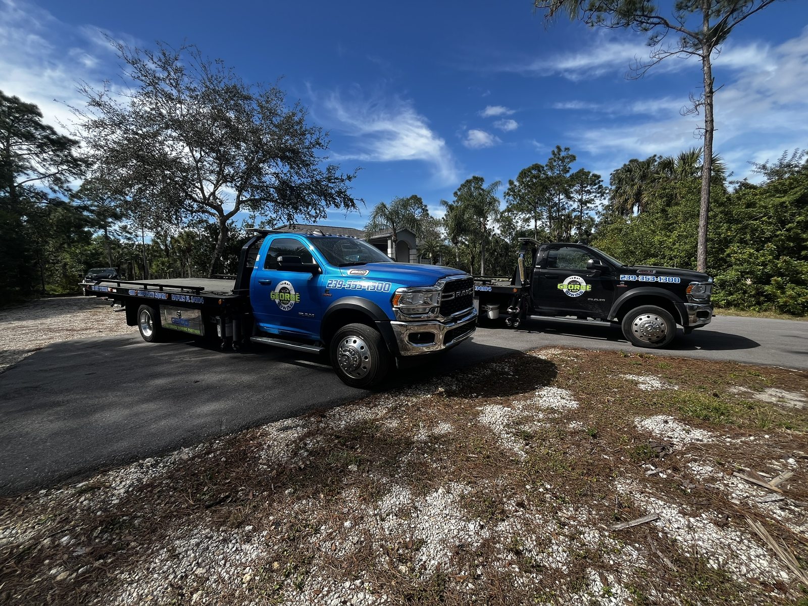 Two George and Sons flatbed tow trucks washed and finished on site in Naples, Florida
